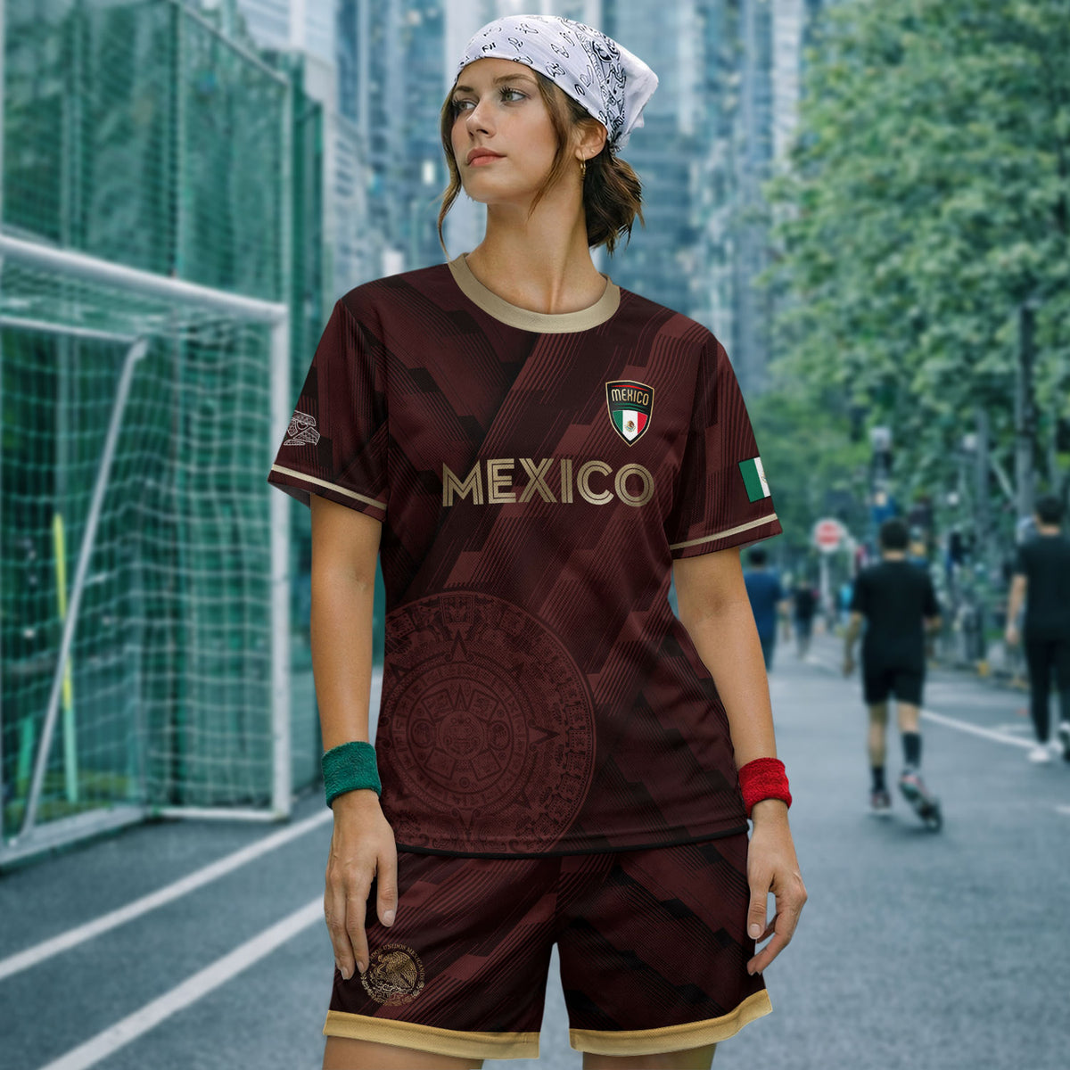 Camiseta de fútbol de México color burdeos con piedra solar azteca dorada y escudo del águila