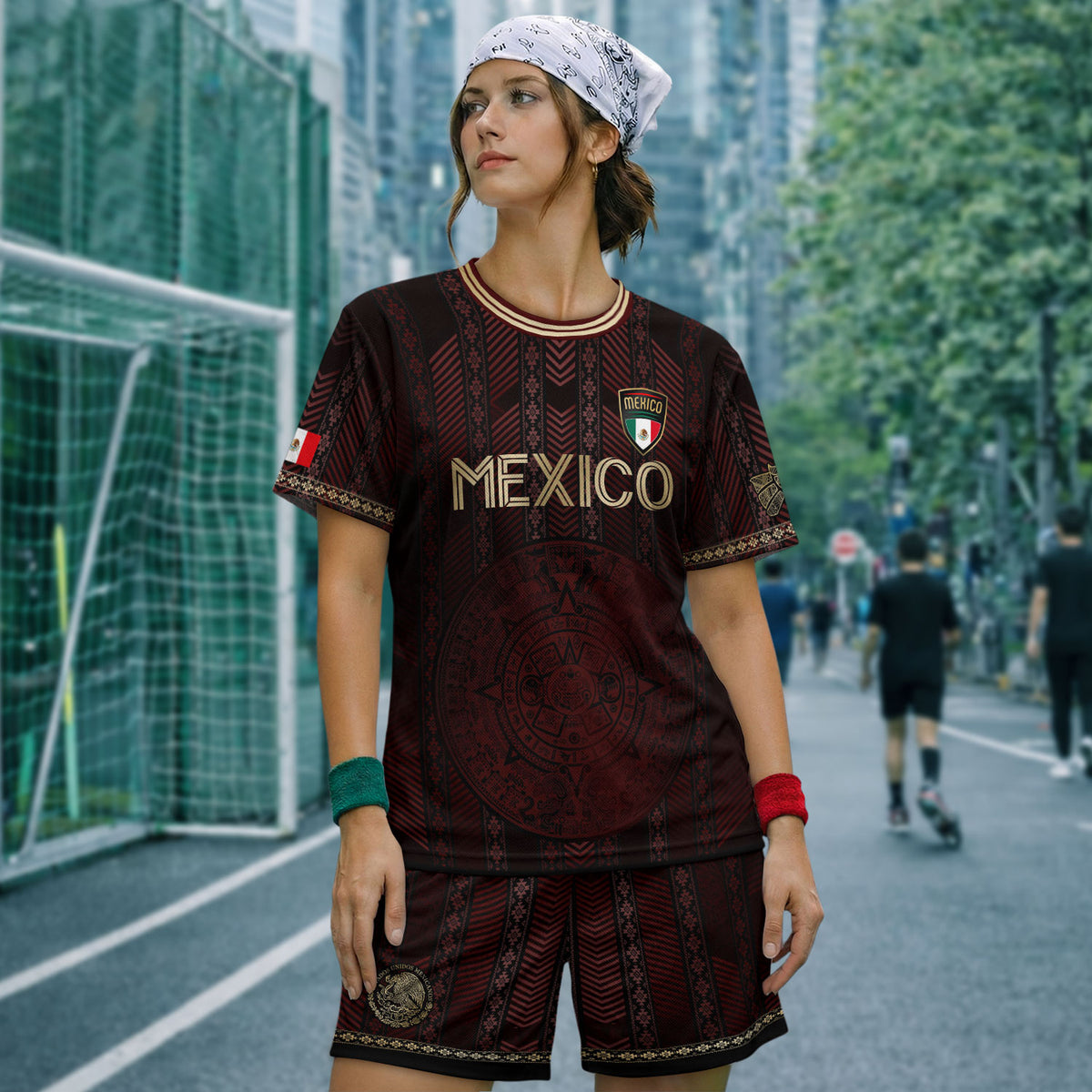 Camiseta de fútbol de México color burdeos con calendario azteca dorado y escudo del águila